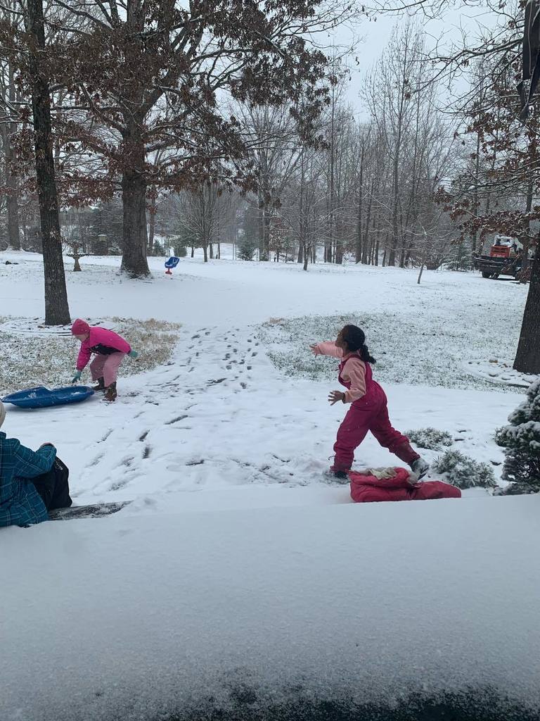 students playing in the snow