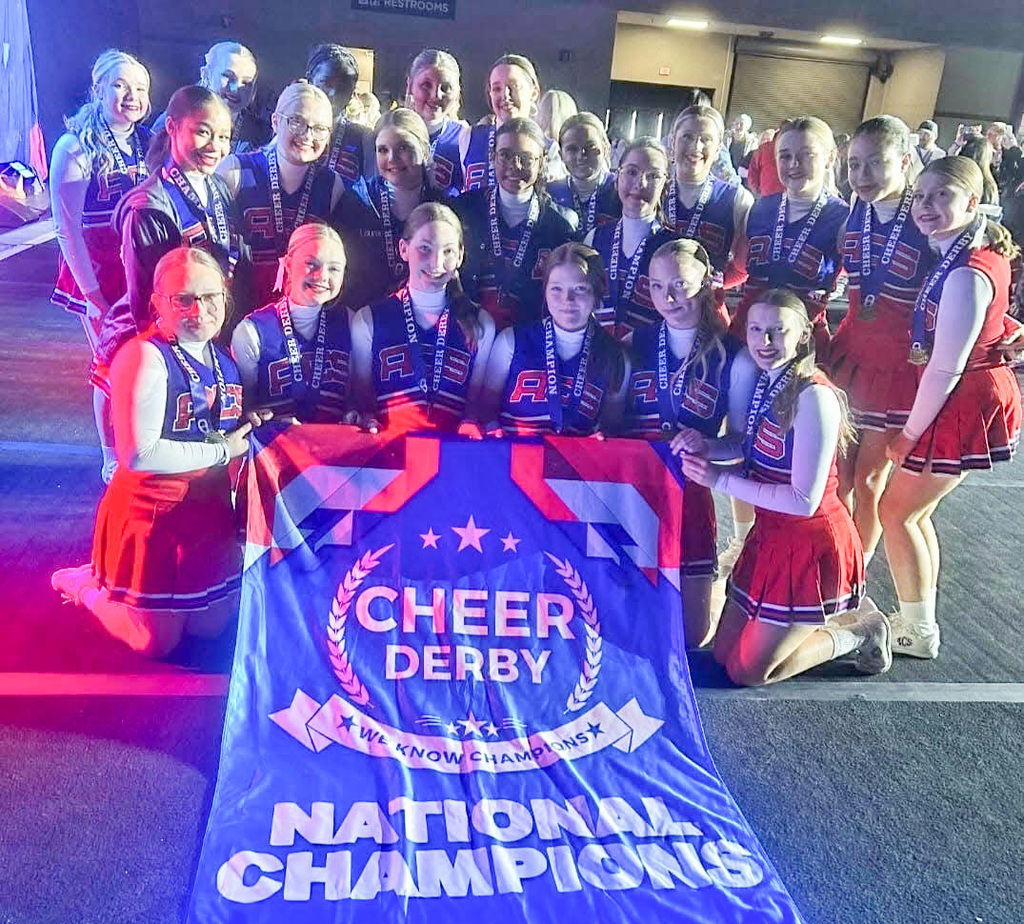 ac-sh cheerleaders with national champions banner