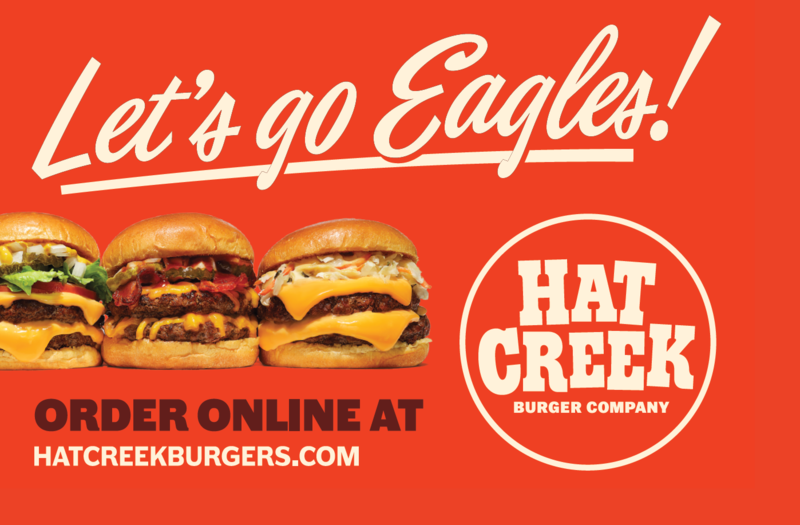 Hat Creek Burger Company says “Let’s go Eagles!” and promotes online ordering.