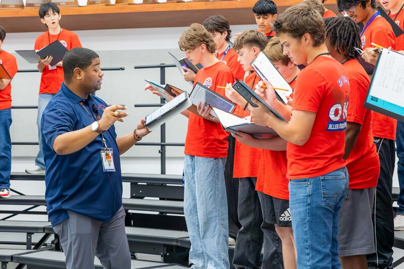 Varsity Mens Choir Practicing, led by Trenton Davis