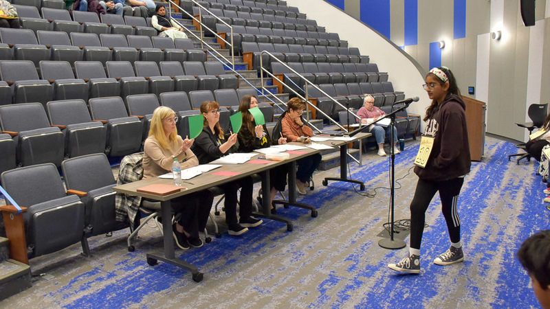 Allen ISD Spelling Bee participant with judges