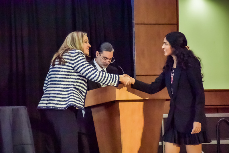 Principal Carrie Jackson congratulates Merit  Finalist