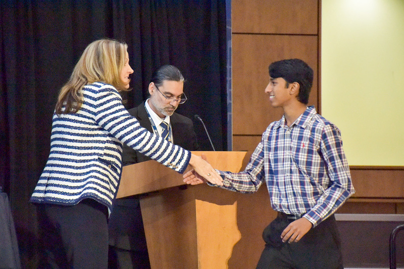 Principal Carrie Jackson congratulates Merit  Finalist