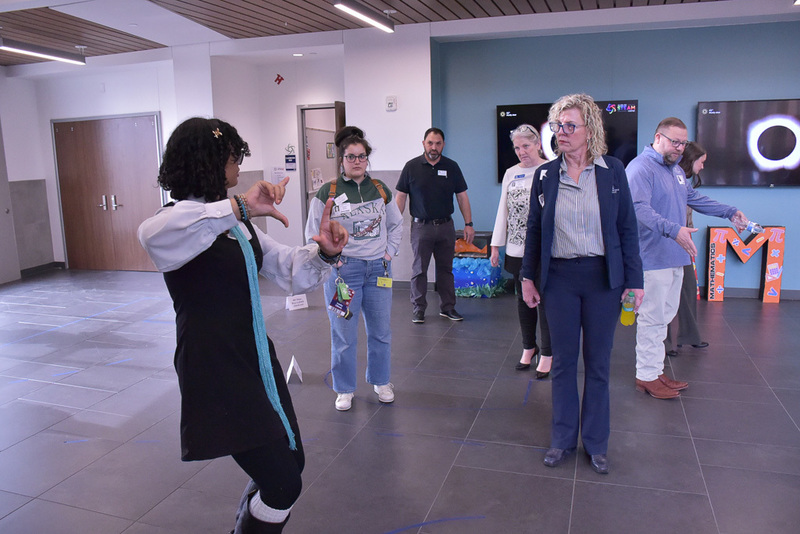 AHS students discuss Easter Bunny photo booth