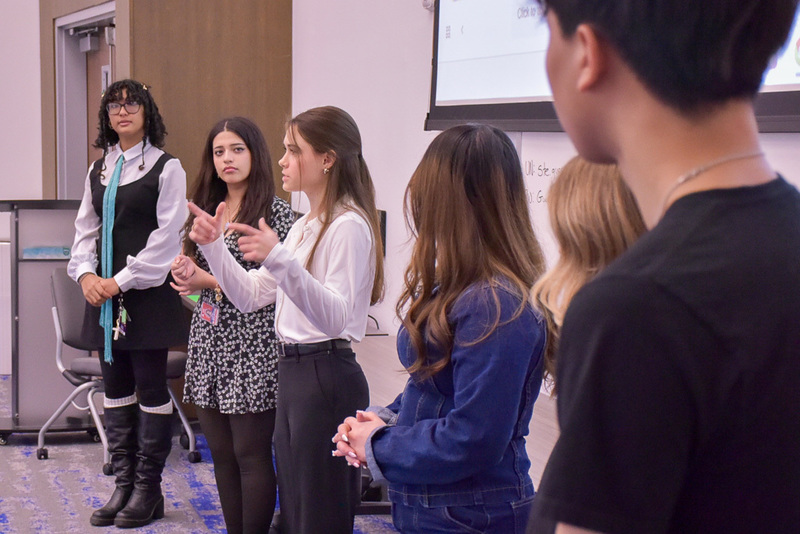AHS students discuss Easter Bunny photo booth
