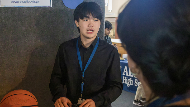 IB student at Theory of Knowledge exhibit