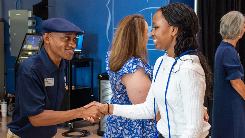 Trustee and student at Associates Degree recognition