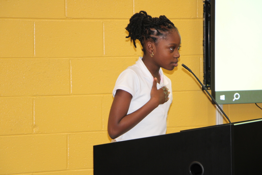 STUDENT DOING PLEDGE OF ALLEGIANCE