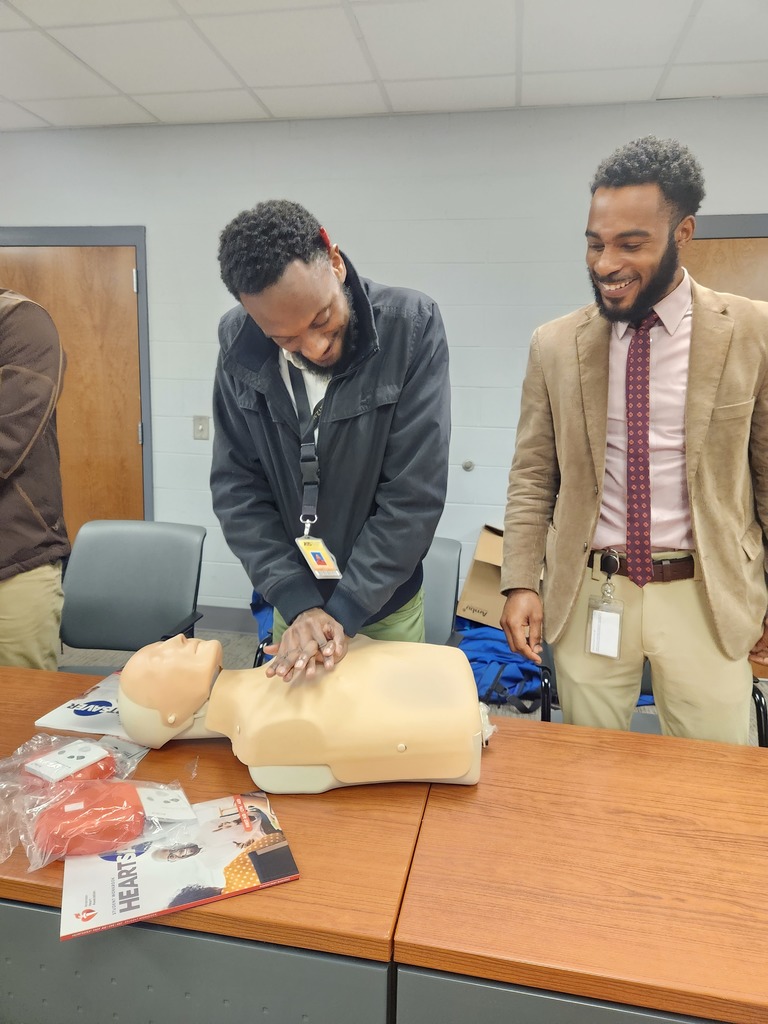 teacher practicing cpr