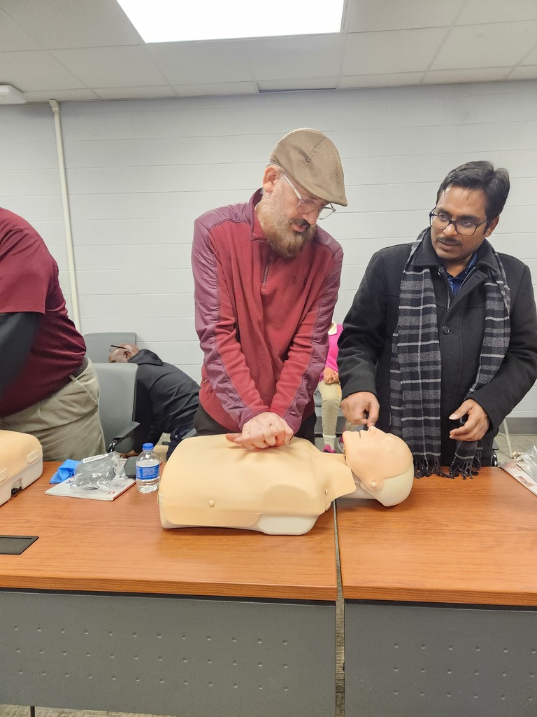 teacher practicing cpr