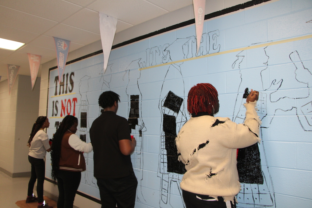 children painting murals