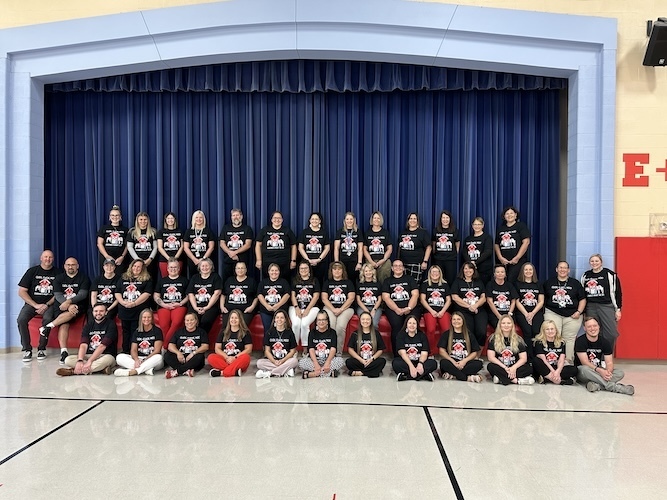 Group picture of AES staff members wearing click clack moo tshirts