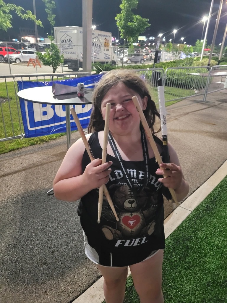 khabri holding drumsticks
