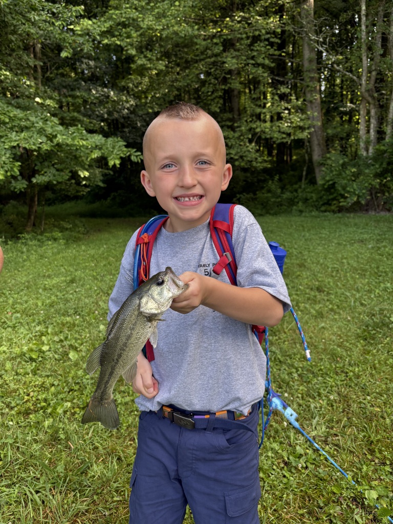 one of the scouts holding a fish