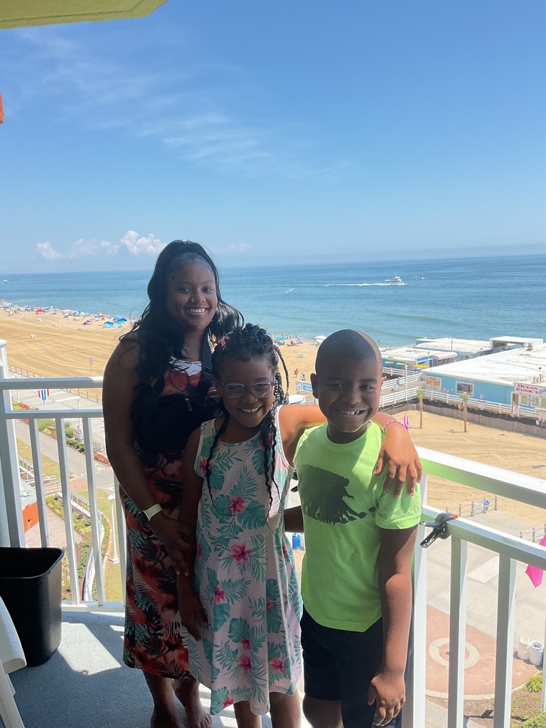 Savannah and Reign on a balcony overlooking the ocean