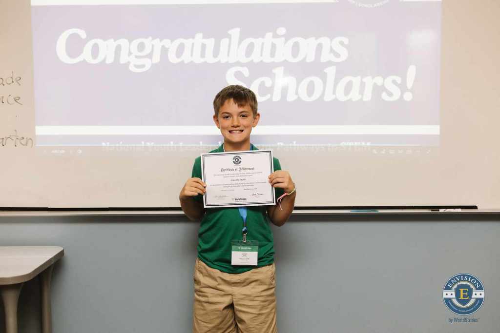 Lincoln holding a certificate after completing the program