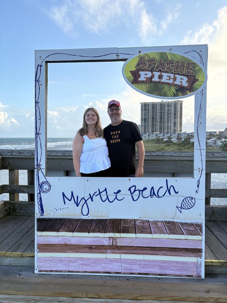 sophia white on a pier with her dad