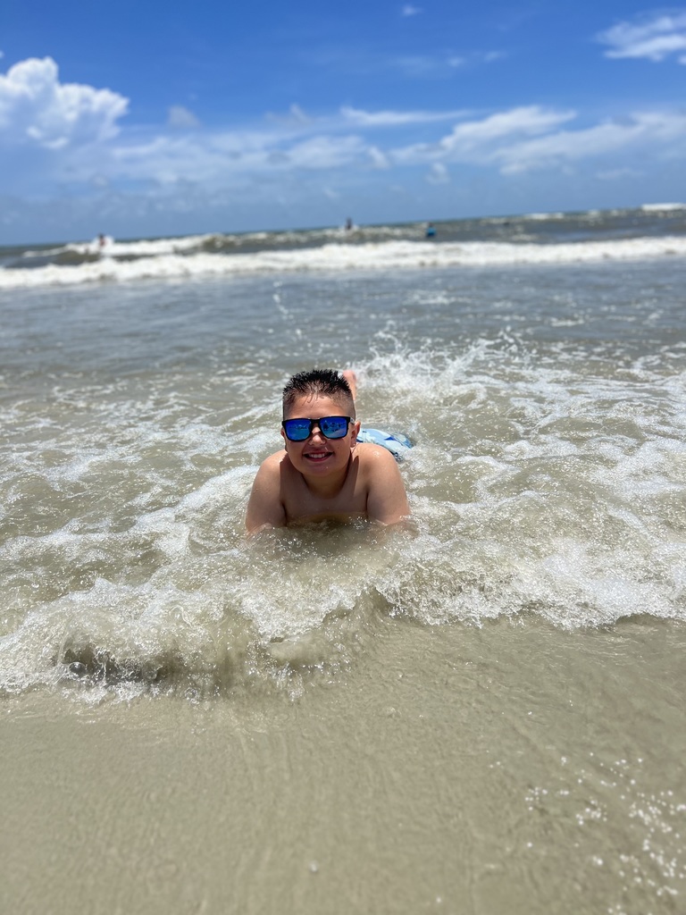 Noah laying in the ocean
