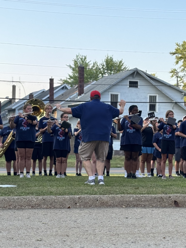 Dr. Charles Page conducting the band