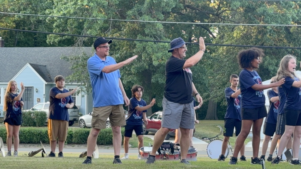 Community members dancing with the band