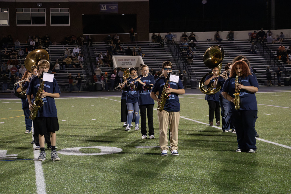 Students performing at the game