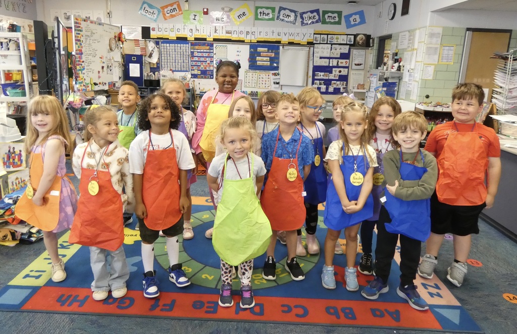 students wearing aprons