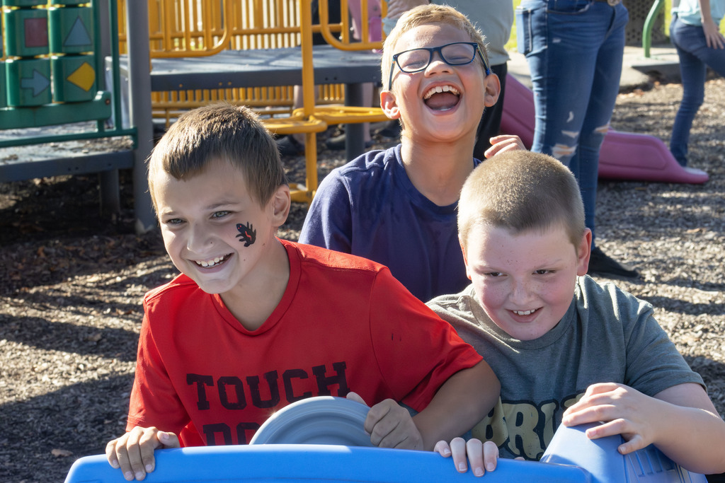 three students smiling