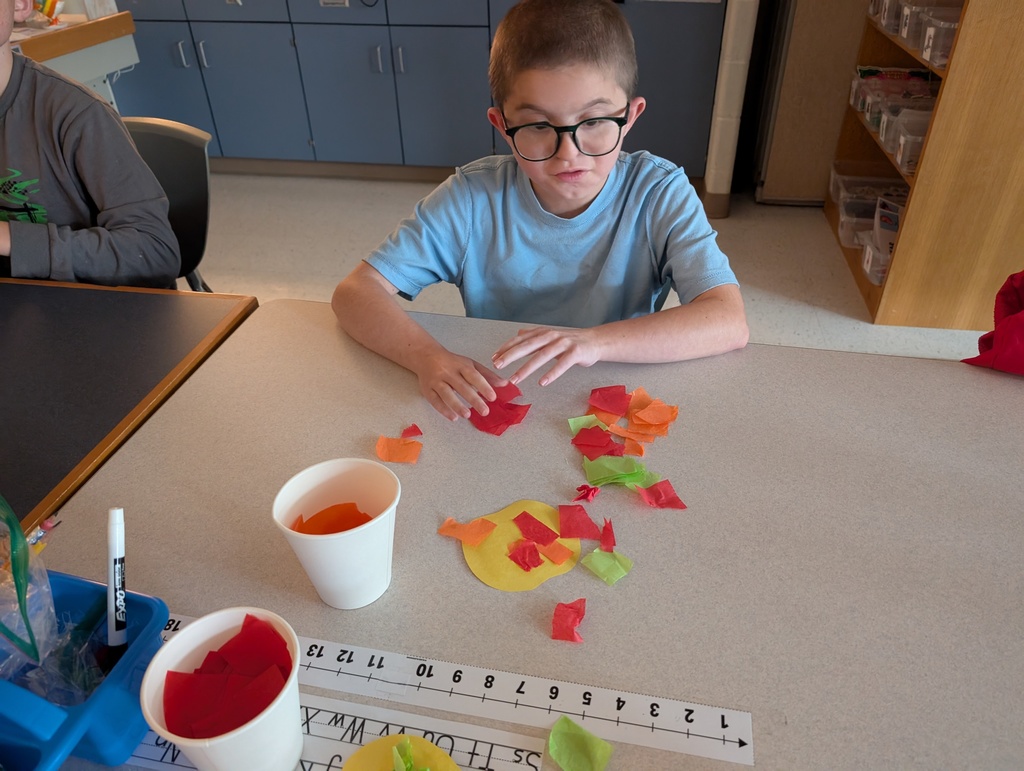 students doing crafts with apples