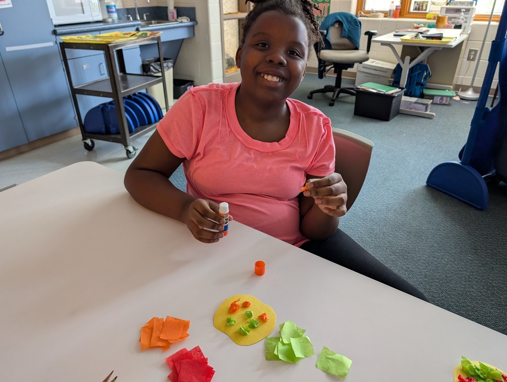students doing crafts with apples