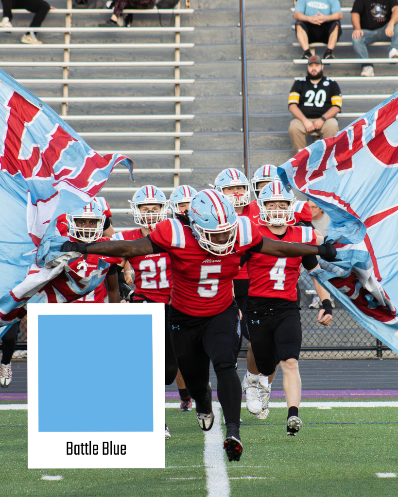 football players running through the Alliance Aviator Banner