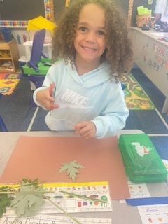 Students making their leaf man