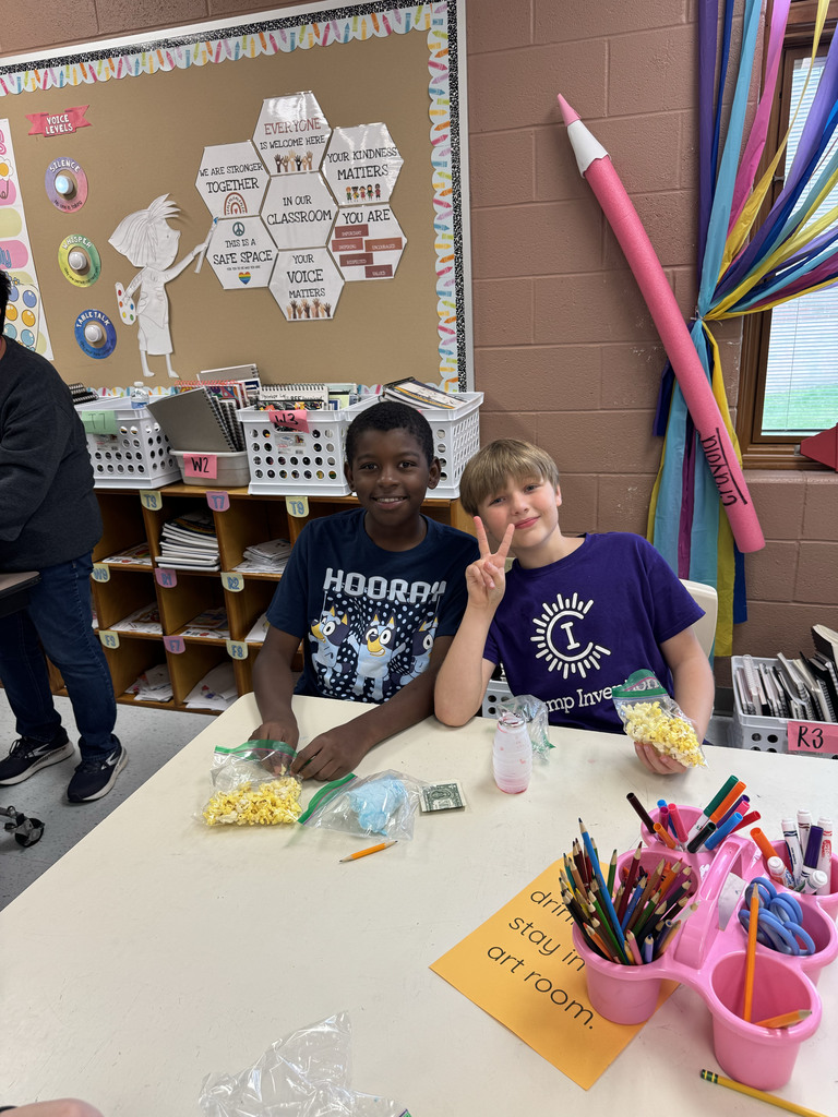 Students eating popcorn and cotton candy