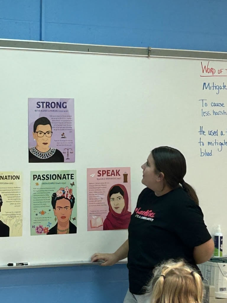 student looking at a poster