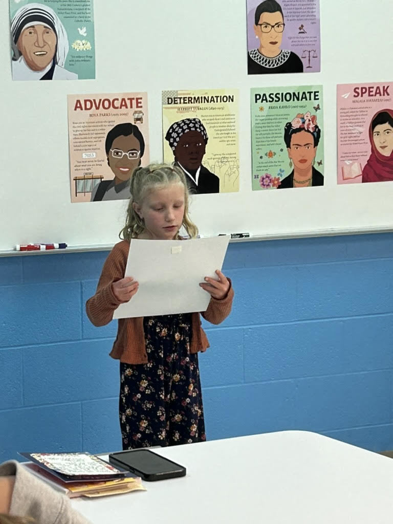 student reading a poster