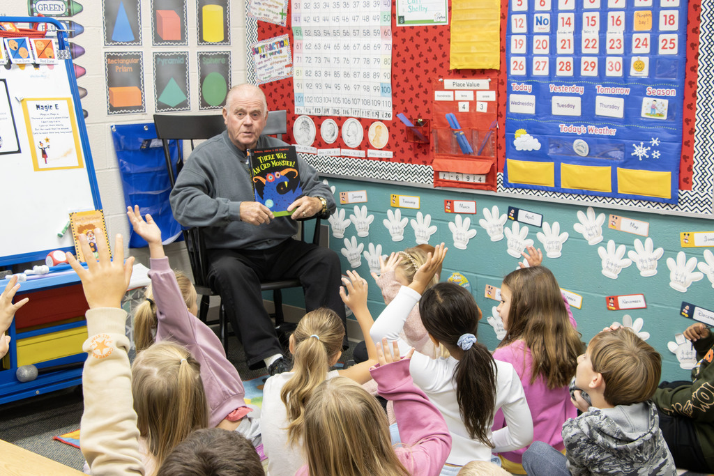 Readers in the classrooms reading to the students