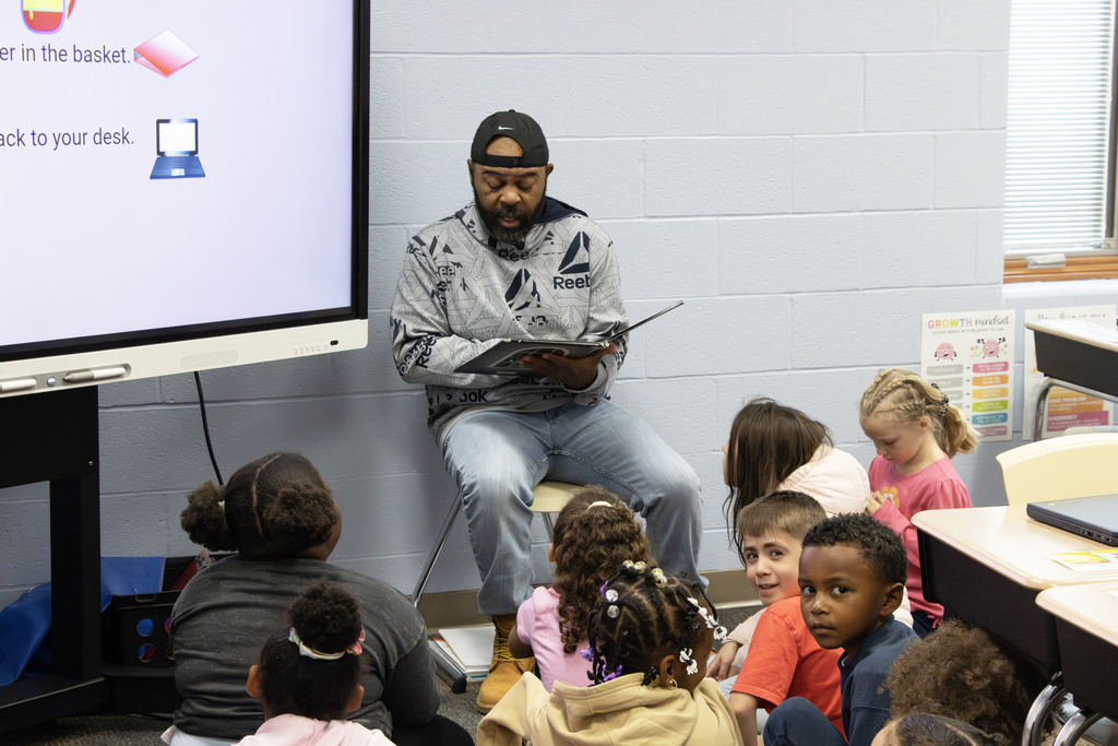 Readers in the classrooms reading to the students