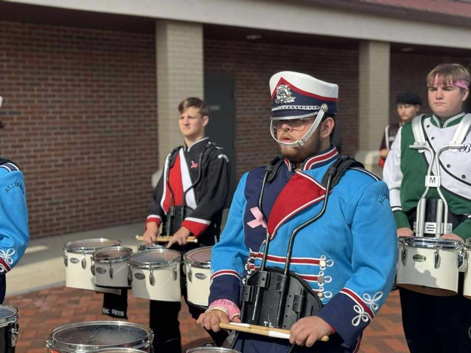 student playing the drums