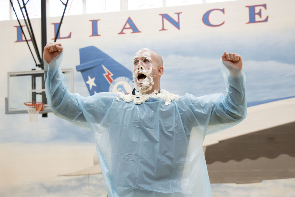Mr. Mosher cheering after getting pied by a student
