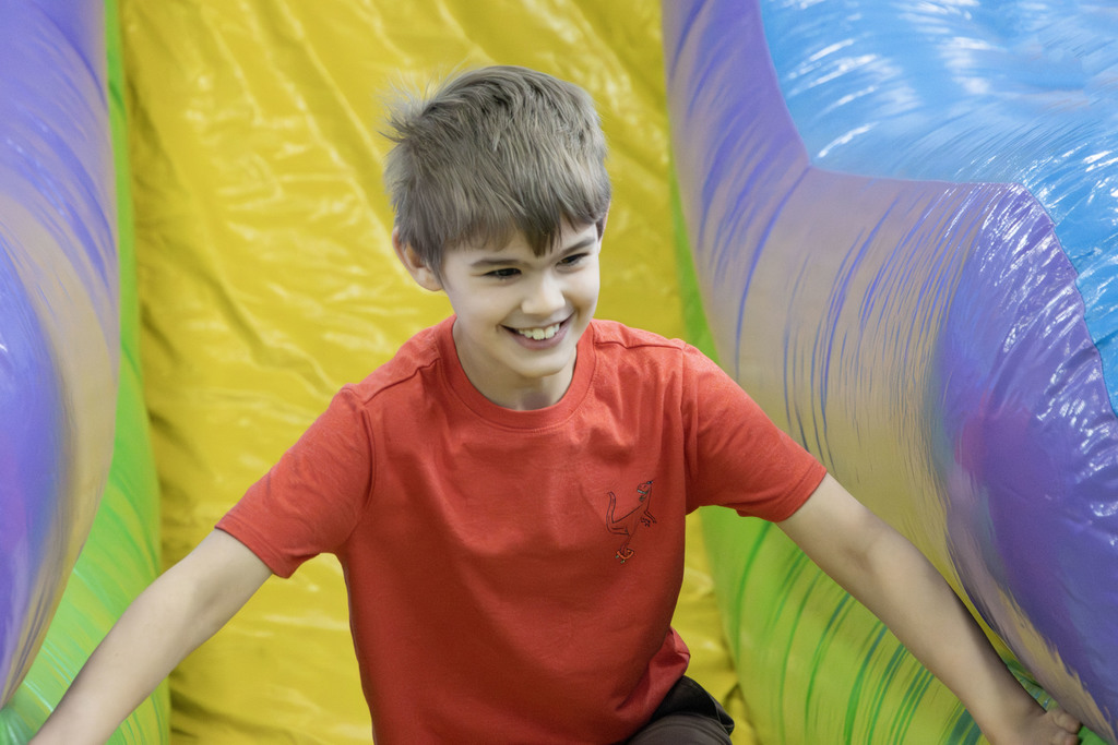 A student smiling on the slide