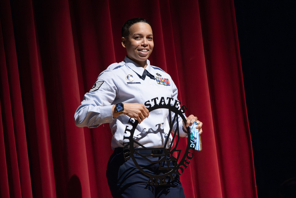 Technical Sergeant Hale holding the gift from the welders