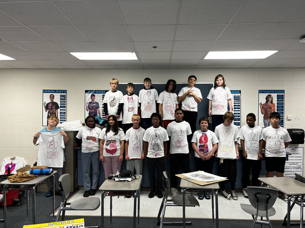 students wearing their shirts