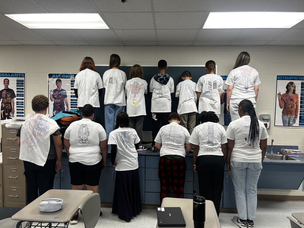 students wearing their shirts