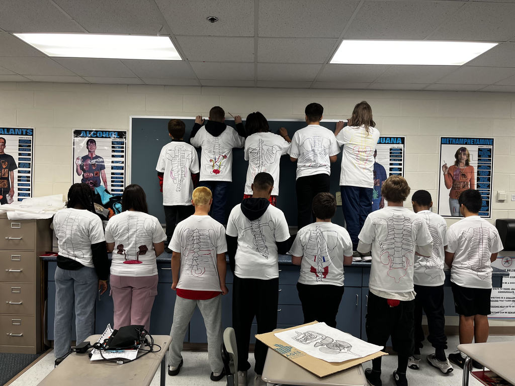 students wearing their shirts
