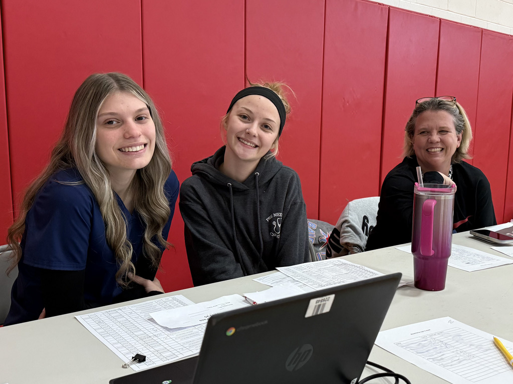 students helping at the registration table