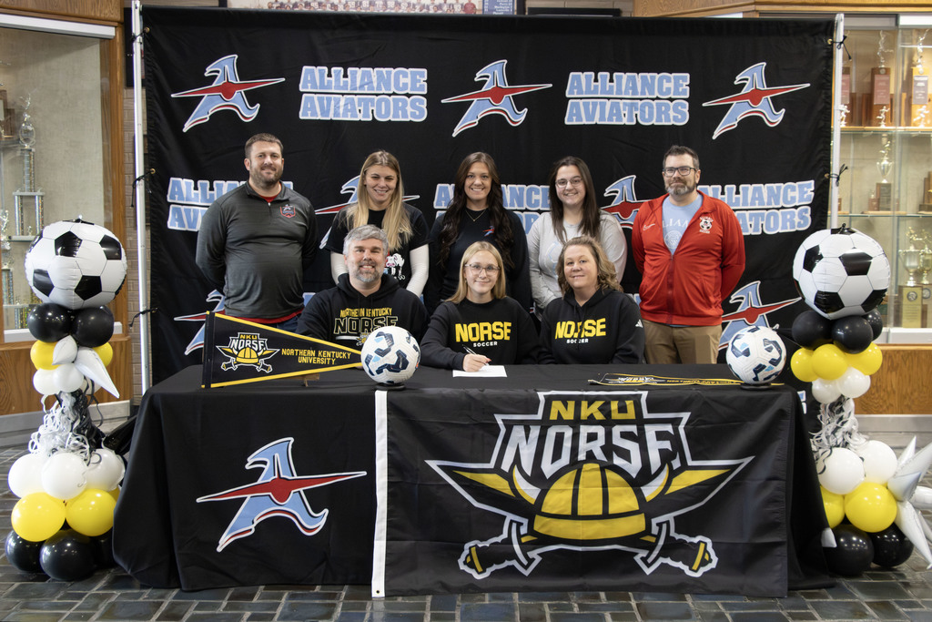 Zellie with her parents and coaches