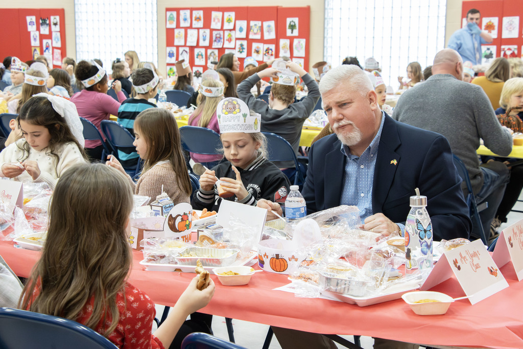 Special guests eating with the students