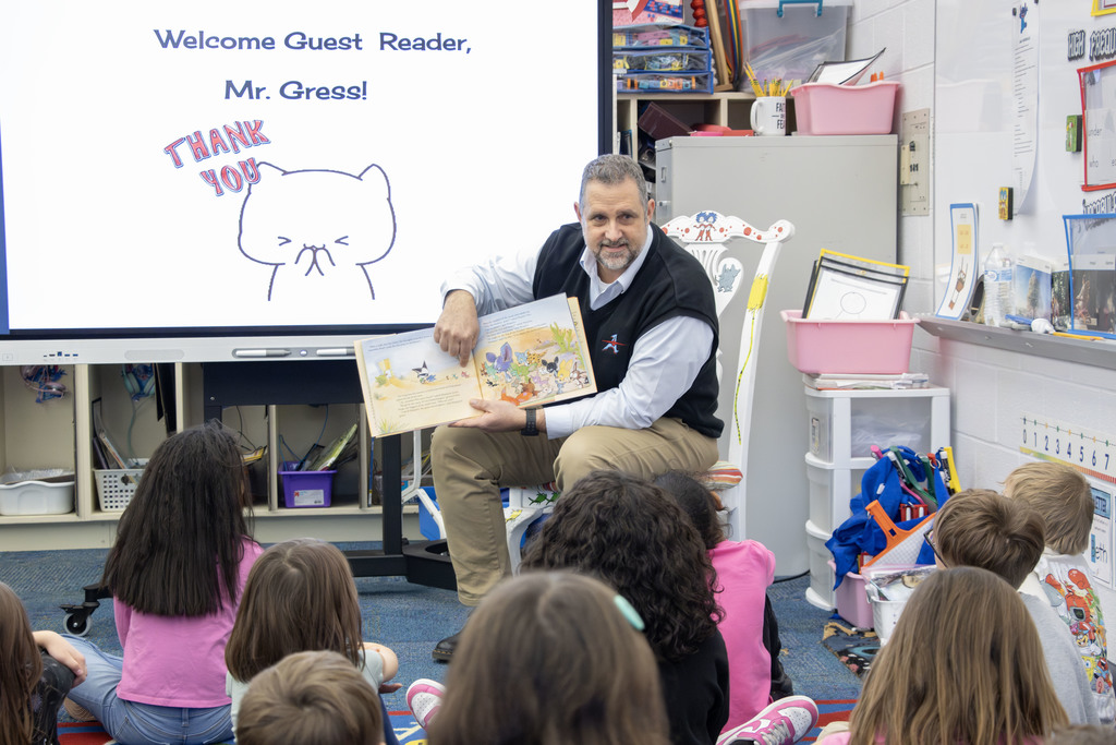 Rob Gress reading to students