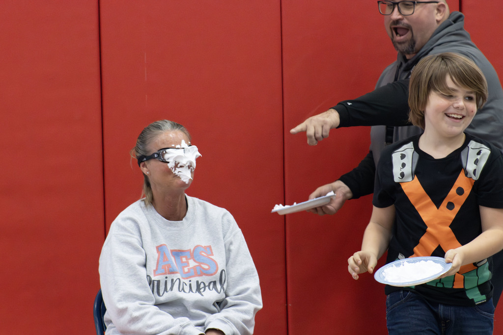 A student pieing Ms. Waller