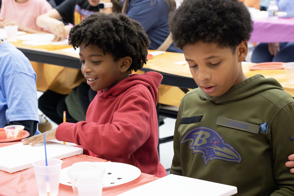 two students painting