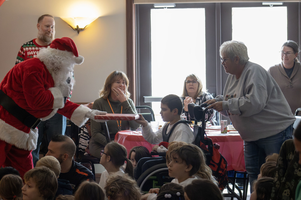 Student getting a gift from santa